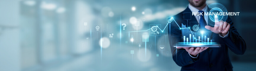 Businessman using the tablet analysis Risk Management and business protection concept, financial risk analysis, compliance strategy, corporate governance, decision making, enterprise security