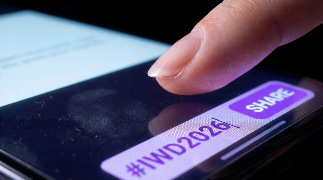 digital activism close up, fingertip hovering over share button on smartphone with IWD2026 hashtag purple glow