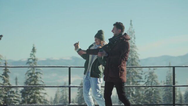 Friends embrace outdoors, Three acquaintances in winter scenic spot celebrate their reunion with hugs and jokes