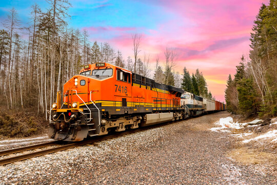 freight train pulling cargo on a beautiful day near Whitefish, Montana