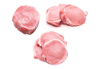Raw pork pieces isolated on a white background.