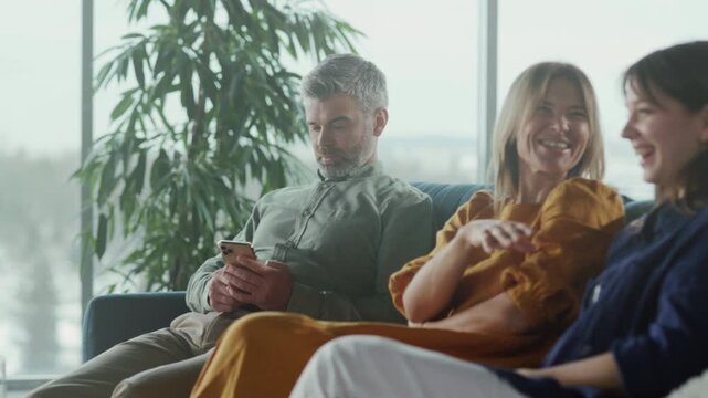 Happy friends sharing moments together, Casual indoor setting where friends share laughter and warm connections