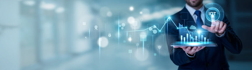 Businessman using the tablet analysis IoT and connected devices concept, smart sensors, data monitoring, industrial internet, real time analytics, digital transformation technology © Theyone