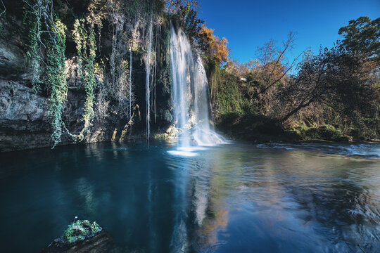Upper Duden Waterfall cascading into a river with long exposure water effects in Antalya, Turkey
