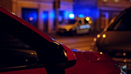 City Police Law Enforcement Vehicle with Blue Roof Strobe Lights on Parked on Street during Intervention © rohawk