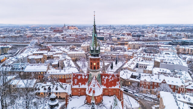 Aerial view of St. Joseph's Church and the evening panorama of Krakow in winter, Poland