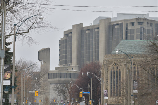 looking west on Hoskin Av to (church) Trinity College Chapel and (brutalist) John P. Robarts Research Library, University of Toronto