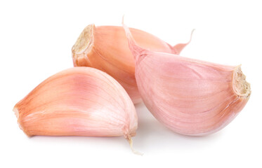Three fresh garlic cloves isolated on white