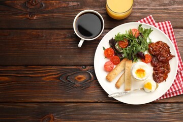 Tasty breakfast with hard boiled egg and bacon served on wooden table, flat lay. Space for text