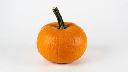 Obraz premium Bright orange pumpkin with stem on white background.
