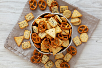 Crunchy Cracker Snack Mix in a Bowl, top view. Flat lay, overhead.