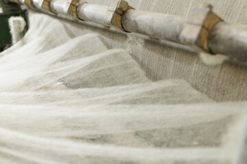 Industrial merino wool fiber processing on textile production machinery © st.kolesnikov