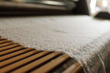 Merino wool fiber web on textile production line closeup © st.kolesnikov