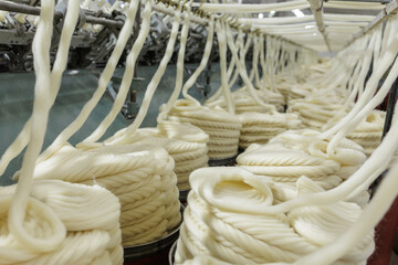 Merino wool yarn coils on industrial textile production line