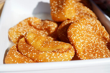 Flattened Crispy fried glutinous rice balls at a Chinese street food market