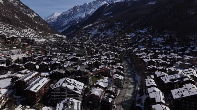 Drone Flyover of Zermatt Town and Wooden Chalets in Swiss Alps