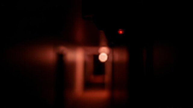 Smart home motion sensor shows fast blinking red LED light in response to movement detection