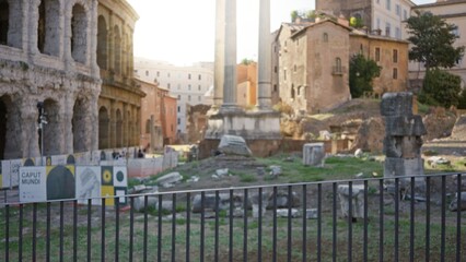 Ancient roman forum ruins defocused with warm soft bokeh in city background; background backplate copyspace calm.