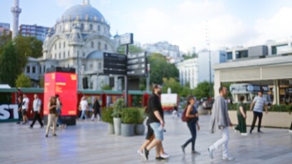 Defocused urban scene with soft bokeh, blurred architectural dome, signage and distant buildings square; template overlay virtual calm.