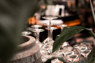 Wine Glasses Upside Down on Bar Counter &ndash; Elegant Restaurant and Hospitality Concept