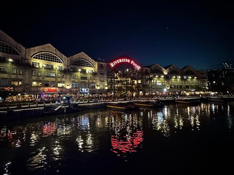 Illuminated Buildings Along the River in Clarke Quay (Singapore, Singapore: July 13, 2023)
