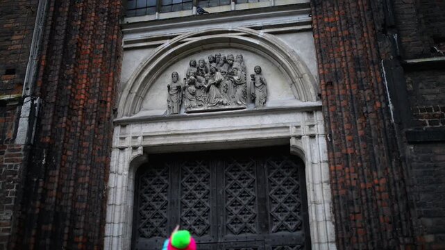 Little girl walks around Basilica in Gdansk