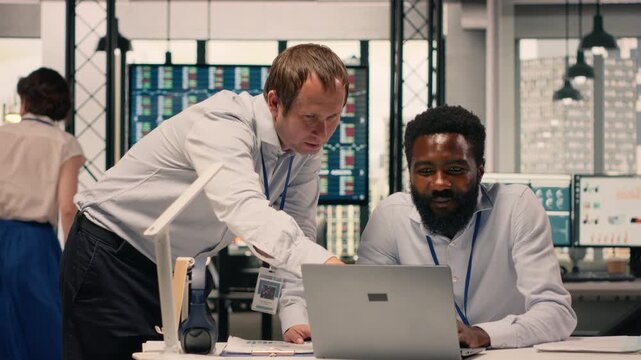 Corporate collaboration, diverse professionals, business intelligence, forecasting data, laptop and reports, productivity and decision making. Productivity, organizational data analysis.