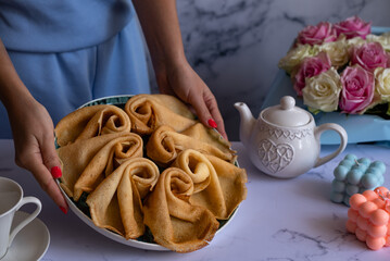 Delicious pancakes for breakfast with flowers