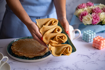 Delicious pancakes for breakfast with flowers