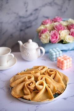 Delicious pancakes for breakfast with flowers