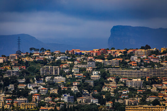 Colorful houses with limestone cliffs of Baou de Saint Jeannet in Nice, France