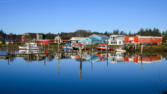 Ilwaco, WA, USA - January 20, 2026; Port of Ilwaco harbor in southwest Washington State with reflection in calm water