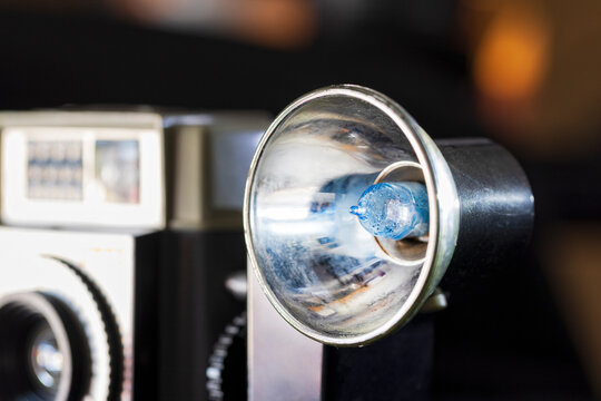 Old Vintage Camera Flash Bulb on Black Background