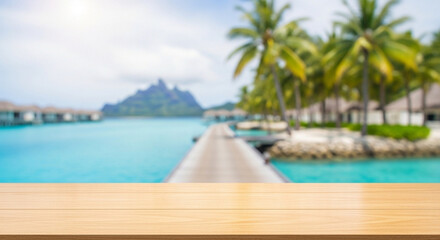 Fototapeta premium Wooden table top with blurred tropical resort and ocean background