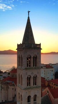 ​Breathtaking 4K Vertical sunset view of St. Anastasia's Cathedral bell tower in Zadar Croatia