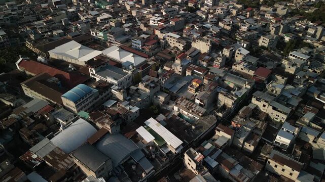 Close up aerial of San Pedro La Laguna Lake Atitlan town with rooftops and homes