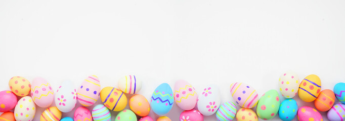 Plakat Colorful Easter Egg bottom border against a white banner background. Top view with copy space.