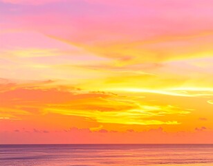 Obraz premium Sunset over a tranquil ocean. Soft pastel colors paint the sky and sea