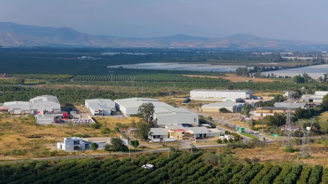 Ciudad Guzman, Jalisco, Mexico industrial buildings for production and distribution, blending with surrounding cultivation, aerial view