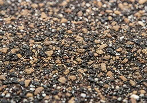 Extreme closeup of asphalt roofing granules brown and black