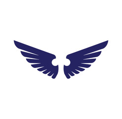Fototapeta premium Dark blue bird wings spread wide in flight symbol of freedom and movement