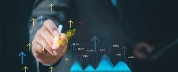 Business strategy concept show entrepreneur launching digital rocket interface in office, use data analytics, growth metrics to drive innovation, market expansion, startup success through technology. © ART STOCK CREATIVE