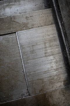 Close-up of weathered metal showing texture and wear from use