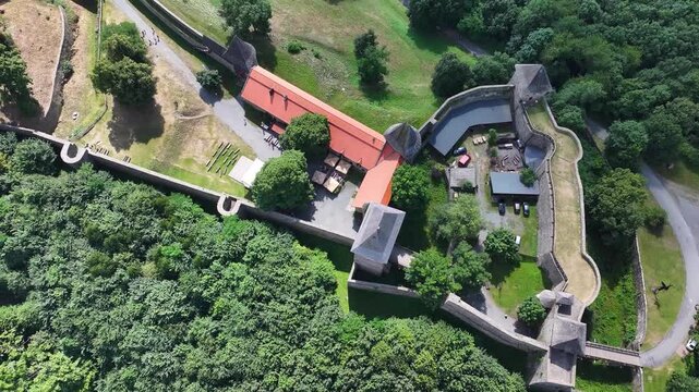 Aerial reveal of Helfstyn Castle complex, historical landmark, stronghold on hill. Czech Republic