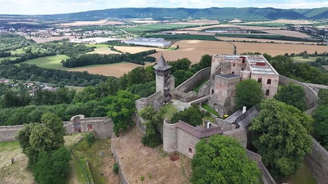 Dynamic Aerial of Helfstyn Castle ruins, historical landmark. Reveal to rural landscape of Czech Republic