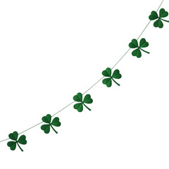 Garland of green shamrock clover leaves strung together on a thin white string against a black background