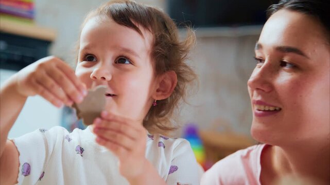 A Joyful Interaction Between a Child and Parent: Exploring Creativity Through Playful Moments and Engaging Activities in a Home Setting