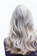 Naklejka premium Long wavy silver grey hair from behind