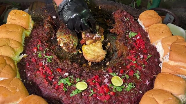 Street-style Kutch Dabeli garnished with pomegranate, peanuts, and sev, served in a festive Indian wedding setting.