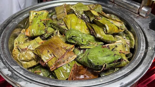 Bhetki paturi served in banana leaves at a Bengali wedding